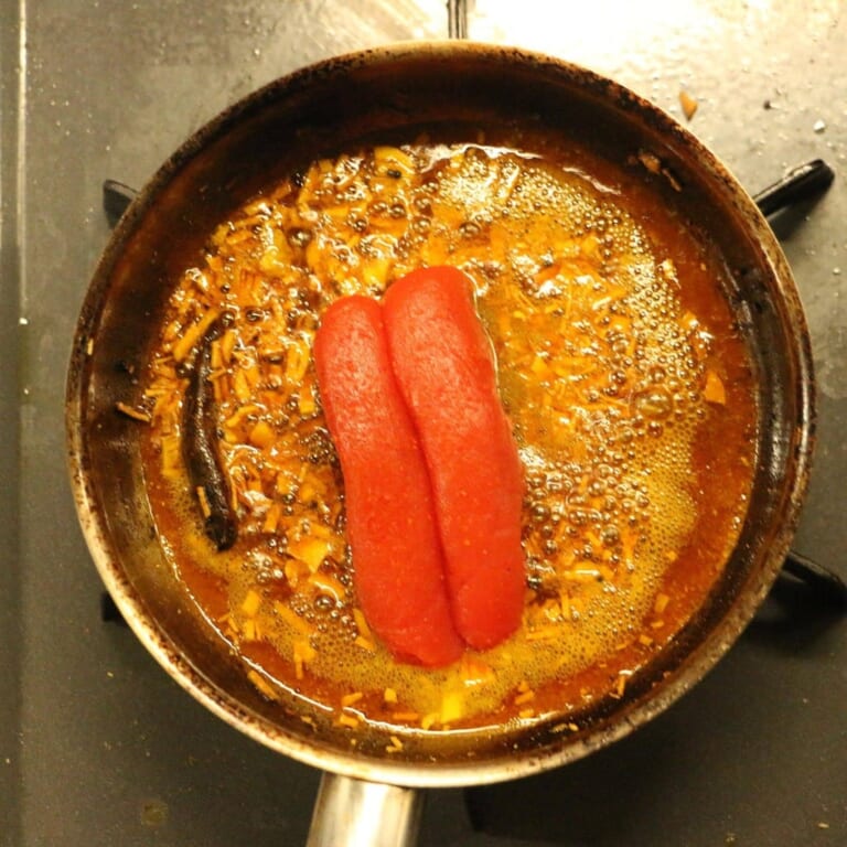 手順 3: 再度火をつけ明太子を加え、レモン汁を加えて完成。